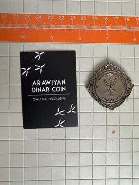 OwlCrate We Hunt the Flame Arawiyan Dinar Coin Hafsah Faizal Icey Designs
